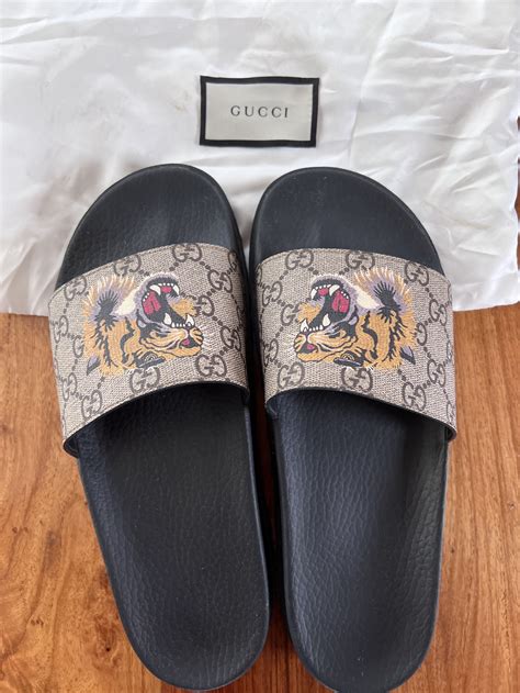 fake tiger gucci slides|Gucci tiger slide goat.